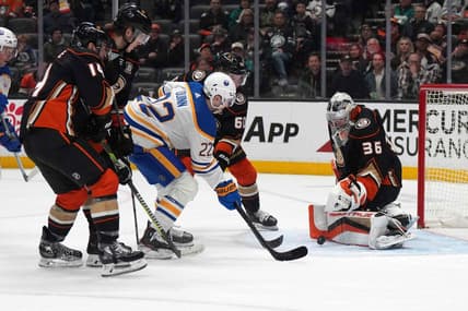 Jan 23, 2024; Anaheim, California, USA; Buffalo Sabres right wing Jack Quinn (22) shoots the puck against Anaheim Ducks goaltender John Gibson (36 at Honda Center. Mandatory Credit: Kirby Lee-USA TODAY Sports