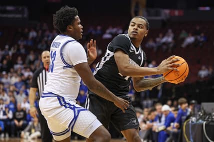 Jan 24, 2024; Newark, New Jersey, USA;  Providence Friars guard Luke Fonts (24) looks to pass as Seton Hall Pirates guard Jaquan Sanders (13) defends during the first half at Prudential Center. Mandatory Credit: Vincent Carchietta-USA TODAY Sports