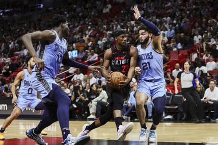 Jan 24, 2024; Miami, Florida, USA; Miami Heat forward Jimmy Butler (22) drives to the basket against Memphis Grizzlies forward David Roddy (21) during the second quarter at Kaseya Center. Mandatory Credit: Sam Navarro-USA TODAY Sports