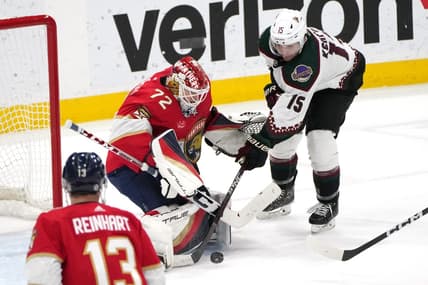 Jan 24, 2024; Sunrise, Florida, USA; Florida Panthers goaltender Sergei Bobrovsky (72) makes a save as Arizona Coyotes center Alexander Kerfoot (15) closes in during the second period at Amerant Bank Arena. Mandatory Credit: Jim Rassol-USA TODAY Sports