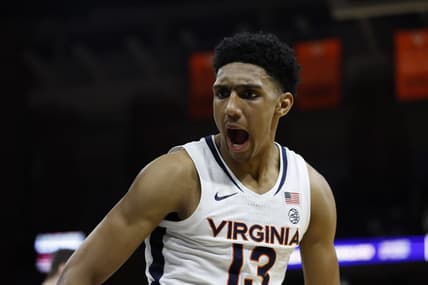 Jan 24, 2024; Charlottesville, Virginia, USA; Virginia Cavaliers guard Ryan Dunn (13) reacts after a dunk against the North Carolina State Wolfpack in overtime at John Paul Jones Arena. Mandatory Credit: Geoff Burke-USA TODAY Sports