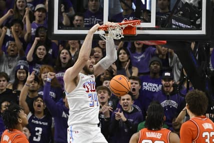 Jan 24, 2024; Evanston, Illinois, USA;  Northwestern Wildcats center Matthew Nicholson (34) dunks the ball against the Illinois Fighting Illini during the first half at Welsh-Ryan Arena. Mandatory Credit: Matt Marton-USA TODAY Sports