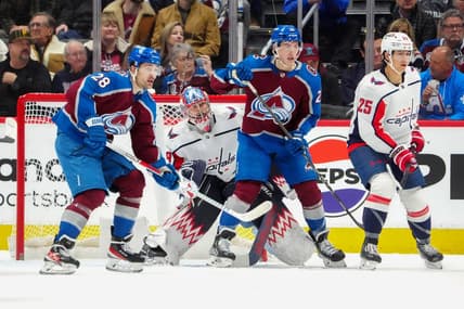 Jan 24, 2024; Denver, Colorado, USA; Colorado Avalanche left wing Miles Wood (28) and center Ross Colton (20) and Washington Capitals goaltender Charlie Lindgren (79) and defenseman Ethan Bear (25) during the first period against the Colorado Avalanche at Ball Arena. Mandatory Credit: Ron Chenoy-USA TODAY Sports