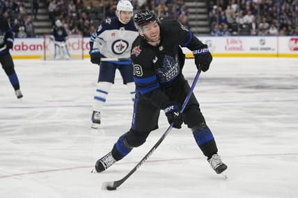Jan 24, 2024; Toronto, Ontario, CAN; Toronto Maple Leafs forward Calle Jarnkrok (19) goes to shoot the puck against the Winnipeg Jets  during the third period at Scotiabank Arena. Mandatory Credit: John E. Sokolowski-USA TODAY Sports