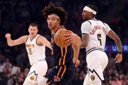 Jan 25, 2024; New York, New York, USA; New York Knicks center Jericho Sims (45) controls the ball against Denver Nuggets center Nikola Jokic (15) and guard Kentavious Caldwell-Pope (5) during the first quarter at Madison Square Garden. Mandatory Credit: Brad Penner-USA TODAY Sports