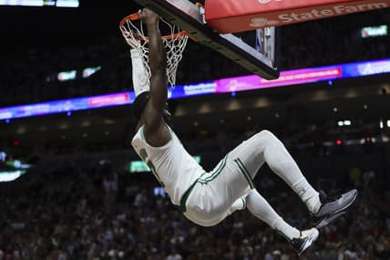Jan 25, 2024; Miami, Florida, USA; Boston Celtics guard Jaylen Brown (7) dunks the basketball against the Miami Heat during the second quarter at Kaseya Center. Mandatory Credit: Sam Navarro-USA TODAY Sports