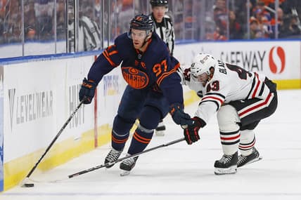 Jan 25, 2024; Edmonton, Alberta, CAN; Edmonton Oilers forward Connor McDavid (97) carries the puck around Chicago Blackhawks forward Colin Blackwell (43) during the first period at Rogers Place. Mandatory Credit: Perry Nelson-USA TODAY Sports