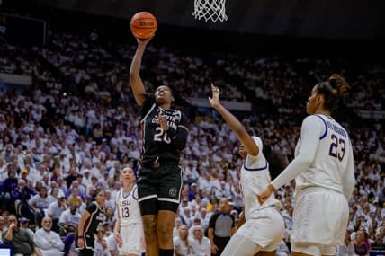 Jan 25, 2024; Baton Rouge, Louisiana, USA; South Carolina Gamecocks forward Sania Feagin (20) shoots against LSU Lady Tigers guard Aneesah Morrow during the second half at Pete Maravich Assembly Center. Mandatory Credit: Matthew Hinton-USA TODAY Sports