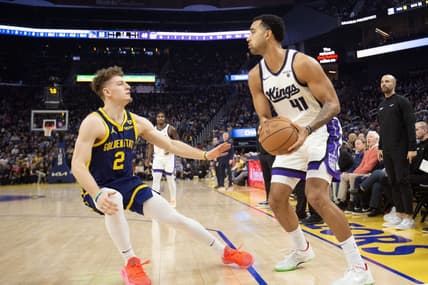 Jan 25, 2024; San Francisco, California, USA; Sacramento Kings forward Trey Lyles (41) looks to pass over Golden State Warriors guard Brandin Podziemski (2) during the first quarter at Chase Center. Mandatory Credit: D. Ross Cameron-USA TODAY Sports