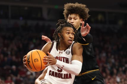 Jan 27, 2024; Columbia, South Carolina, USA; South Carolina Gamecocks guard Meechie Johnson (5) drives around Missouri Tigers forward Jordan Butler (0) in the first half at Colonial Life Arena. Mandatory Credit: Jeff Blake-USA TODAY Sports