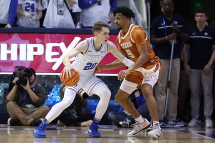 Jan 27, 2024; Provo, Utah, USA; Brigham Young Cougars guard Spencer Johnson (20) drives to the basket against Texas Longhorns guard Ithiel Horton (9) during the first half at Marriott Center. Mandatory Credit: Rob Gray-USA TODAY Sports