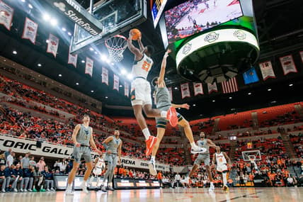 Jan 27, 2024; Stillwater, Oklahoma, USA; Oklahoma State Cowboys center Brandon Garrison (23) puts up a shot against the West Virginia Mountaineers during the first half at Gallagher-Iba Arena. Mandatory Credit: William Purnell-USA TODAY Sports