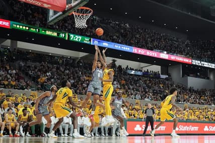 Jan 27, 2024; Waco, Texas, USA; TCU Horned Frogs guard Micah Peavy (0) shoots over Baylor Bears guard Ja'Kobe Walter (4) during the first half at Paul and Alejandra Foster Pavilion. Mandatory Credit: Raymond Carlin III-USA TODAY Sports