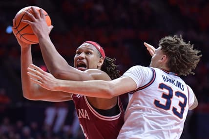 Jan 27, 2024; Champaign, Illinois, USA;  Indiana Hoosiers forward Malik Reneau (5) drives to the basket against Illinois Fighting Illini forward Coleman Hawkins (33) during the second half at State Farm Center. Mandatory Credit: Ron Johnson-USA TODAY Sports