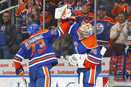 Jan 27, 2024; Edmonton, Alberta, CAN; Edmonton Oilers defensemen Vincent Desharnais (73) and goaltender Stuart Skinner (74) celebrate the Oilers 4-1 victory over the Nashville Predators. It is the Oilers 16th straight win at Rogers Place. Mandatory Credit: Perry Nelson-USA TODAY Sports