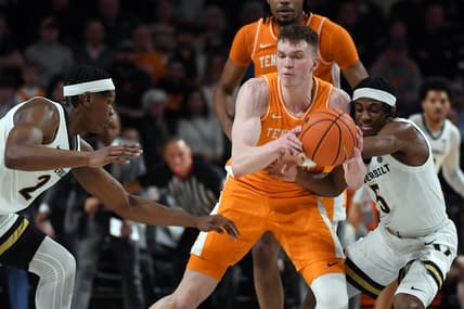 Jan 27, 2024; Nashville, Tennessee, USA; Tennessee Volunteers guard Dalton Knecht (3) is defended by Vanderbilt Commodores guard Ezra Manjon (5) and forward Ven-Allen Lubin (2) during the first half at Memorial Gymnasium. Mandatory Credit: Christopher Hanewinckel-USA TODAY Sports