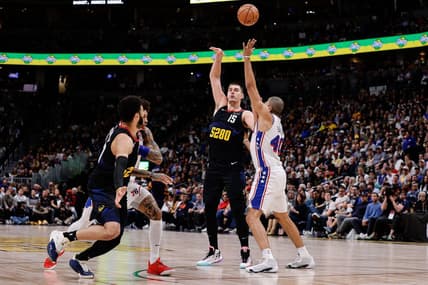 Jan 27, 2024; Denver, Colorado, USA; Denver Nuggets center Nikola Jokic (15) looks to pass the ball to guard Jamal Murray (27) as Philadelphia 76ers forward Nicolas Batum (40) and guard Kelly Oubre Jr. (9) defend in the second quarter at Ball Arena. Mandatory Credit: Isaiah J. Downing-USA TODAY Sports