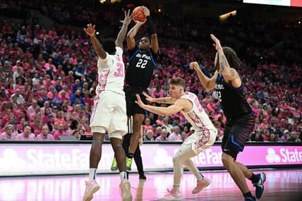 Jan 27, 2024; Omaha, Nebraska, USA; DePaul Blue Demons guard Elijah Fisher (22) attempt a shot against Creighton Bluejays center Fredrick King (33) in the first half at CHI Health Center Omaha. Mandatory Credit: Steven Branscombe-USA TODAY Sports