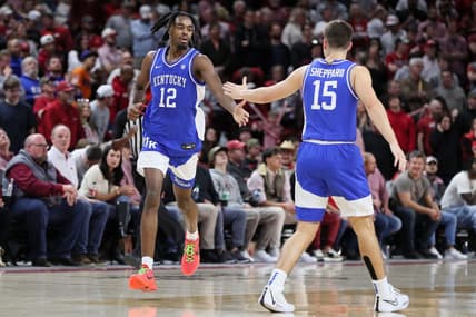 Jan 27, 2024; Fayetteville, Arkansas, USA; Kentucky Wildcats guard Antonio Reeves (12) celebrates with guard Reed Sheppard (15) after making a three point shot in the second half against the Arkansas Razorbacks at Bud Walton Arena. Kentucky won 63-57. Mandatory Credit: Nelson Chenault-USA TODAY Sports