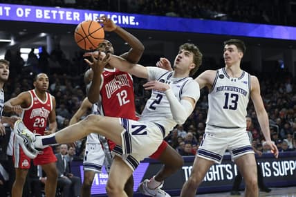 Jan 27, 2024; Evanston, Illinois, USA; Ohio State Buckeyes guard Evan Mahaffey (12) and Northwestern Wildcats forward Nick Martinelli (2) fight for a rebound during the first half  at Welsh-Ryan Arena. Mandatory Credit: Matt Marton-USA TODAY Sports