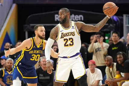 Jan 27, 2024; San Francisco, California, USA; Golden State Warriors forward Draymond Green (23) handles the ball against Golden State Warriors guard Stephen Curry (30) during overtime at Chase Center. Mandatory Credit: Darren Yamashita-USA TODAY Sports