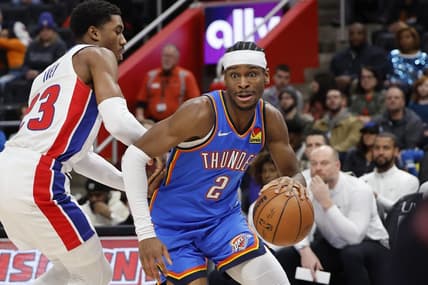 Jan 28, 2024; Detroit, Michigan, USA; Oklahoma City Thunder guard Shai Gilgeous-Alexander (2) dribbles defended by Detroit Pistons guard Jaden Ivey (23) in the first half at Little Caesars Arena. Mandatory Credit: Rick Osentoski-USA TODAY Sports