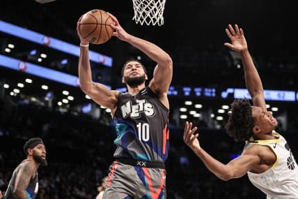 Jan 29, 2024; Brooklyn, New York, USA;  Brooklyn Nets guard Ben Simmons (10) grabs a rebound past Utah Jazz guard Collin Sexton (2) in the second quarter against the Utah Jazz at Barclays Center. Mandatory Credit: Wendell Cruz-USA TODAY Sports