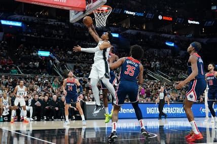 Jan 29, 2024; San Antonio, Texas, USA;  San Antonio Spurs forward Keldon Johnson (3) goes up for a shot in front of Washington Wizards forward Marvin Bagley III (35) in the first half at Frost Bank Center. Mandatory Credit: Daniel Dunn-USA TODAY Sports