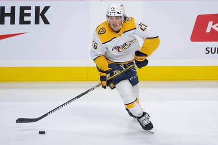 Jan 29, 2024; Ottawa, Ontario, CAN; Nashville Predators center Philip Tomasino (26) controls the puck in the third period against the Ottawa Senators at the Canadian Tire Centre. Mandatory Credit: Marc DesRosiers-USA TODAY Sports