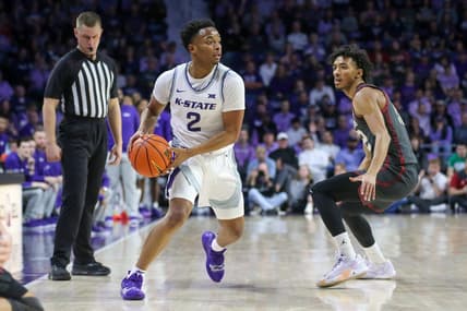 Jan 30, 2024; Manhattan, Kansas, USA; Kansas State Wildcats guard Tylor Perry (2) is guarded by Oklahoma Sooners guard Milos Uzan (12) during the first half at Bramlage Coliseum. Mandatory Credit: Scott Sewell-USA TODAY Sports