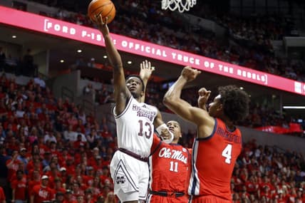 Jan 30, 2024; Oxford, Mississippi, USA; Mississippi State Bulldogs guard Josh Hubbard (13) drives to the basket as Mississippi Rebels guard Matthew Murrell (11) and forward Jaemyn Brakefield (4) defends during the first half at The Sandy and John Black Pavilion at Ole Miss. Mandatory Credit: Petre Thomas-USA TODAY Sports