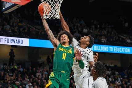 Jan 31, 2024; Orlando, Florida, USA; Baylor Bears forward Jalen Bridges (11) goes to the basket against UCF Knights forward Marchelus Avery (13) during the first half at Addition Financial Arena. Mandatory Credit: Mike Watters-USA TODAY Sports