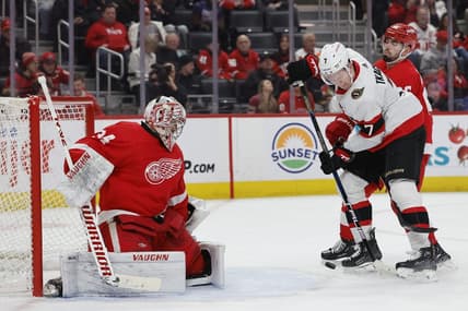 Jan 31, 2024; Detroit, Michigan, USA;  Ottawa Senators left wing Brady Tkachuk (7) tries to score on Detroit Red Wings goaltender Alex Lyon (34) in the first period at Little Caesars Arena. Mandatory Credit: Rick Osentoski-USA TODAY Sports