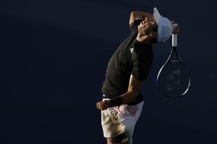 Mar 23, 2022; Miami Gardens, FL, USA; Jaume Munar (ESP) serves against Taro Daniel (JPN) (not pictured) in a first round men's singles match in the Miami Open at Hard Rock Stadium. Mandatory Credit: Geoff Burke-USA TODAY Sports