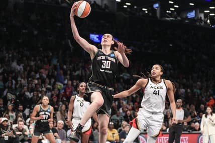 Oct 15, 2023; Brooklyn, New York, USA; New York Liberty forward Breanna Stewart (30) drives past Las Vegas Aces center Kiah Stokes (41) for a layup in the third quarter during game three of the 2023 WNBA Finals at Barclays Center. Mandatory Credit: Wendell Cruz-USA TODAY Sports