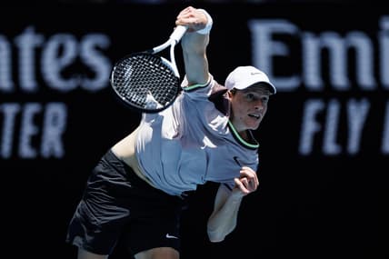 Jan 14, 2024; Melbourne, Victoria, Australia;   Jannik Sinner of Italy hits a shot against Botic Van De Zandschulp of the Netherlands in the first round of the men s singles. Mandatory Credit: Mike Frey-USA TODAY Sports