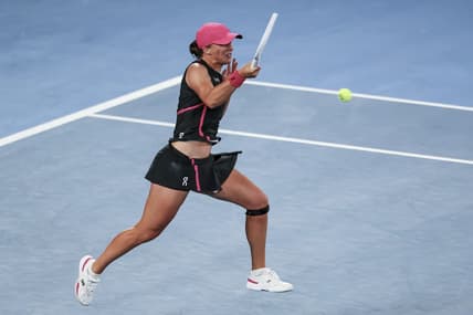 Jan 20, 2024; Melbourne, Victoria, Australia; Iga Swiatek of Poland plays a shot against Linda Noskova (not pictured) of Czechia in Round 3 of the Women's Singles on Day 7 of the Australian Open tennis at Rod Laver Arena. Mandatory Credit: Mike Frey-USA TODAY Sports