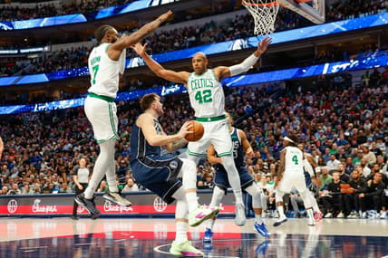 Jan 22, 2024; Dallas, Texas, USA; Dallas Mavericks guard Luka Doncic (77) looks to shoot with Boston Celtics center Al Horford (42) and guard Jaylen Brown (7) defending during the third quarter at American Airlines Center. Mandatory Credit: Andrew Dieb-USA TODAY Sports