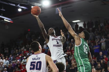 Jan 28, 2024; Boca Raton, Florida, USA; Florida Atlantic Owls guard Johnell Davis (1) shoots the basketball over North Texas Mean Green forward Robert Allen (10) during the second half at Eleanor R. Baldwin Arena. Mandatory Credit: Sam Navarro-USA TODAY Sports
