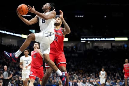 Xavier Musketeers guard Quincy Olivari (8) scores at the basket in the first half of a college basketball game between the St. John's Red Storm and the Xavier Musketeers, Wednesday, Jan. 31, 2024, at Cintas Center in Cincinnati.
