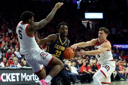 Feb 1, 2024; Tucson, Arizona, USA; California Golden Bears guard Jalen Celestine (32) drives to the net against Arizona Wildcats guard KJ Lewis (5) and guard Pelle Larsson (3) during the first half at McKale Center. Mandatory Credit: Zachary BonDurant-USA TODAY Sports
