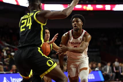Feb 1, 2024; Los Angeles, California, USA; USC Trojans guard Bronny James (6) passes the ball against Oregon Ducks forward Mahamadou Diawara (24) during the first half at Galen Center. Mandatory Credit: Kiyoshi Mio-USA TODAY Sports