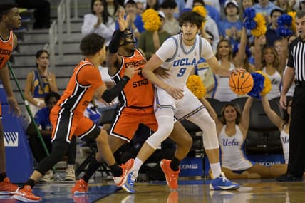 Feb 1, 2024; Los Angeles, California, USA; Oregon State Beavers guard Jordan Pope (0) and guard Dexter Akanno (4) defend UCLA Bruins forward Berke Buyuktuncel (9) in the first half at Pauley Pavilion presented by Wescom. Mandatory Credit: Jayne Kamin-Oncea-USA TODAY Sports