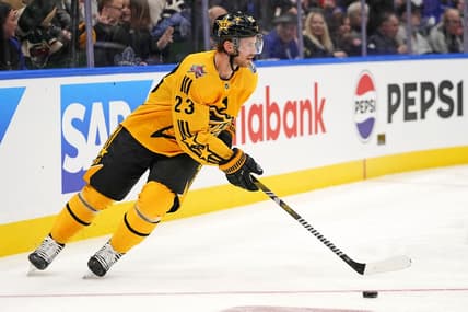 Feb 3, 2024; Toronto, Ontario, CAN; Team MacKinnon center Elias Lindholm (23) of the Vancouver Canucks moves the puck in the 2024 NHL All-Star Game at Scotiabank Arena. Mandatory Credit: John E. Sokolowski-USA TODAY Sports