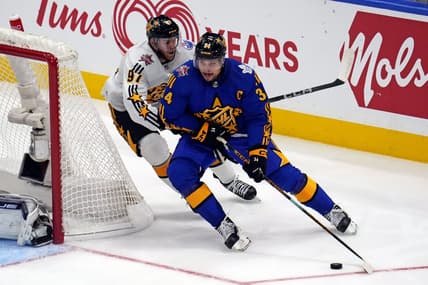 Feb 3, 2024; Toronto, Ontario, CAN; Team Matthews center Auston Matthews (34) of the Toronto Maple Leafs moves the puck against Team McDavid center Connor McDavid (97) of the Edmonton Oilers in the 2024 NHL All-Star Game at Scotiabank Arena. Mandatory Credit: John E. Sokolowski-USA TODAY Sports