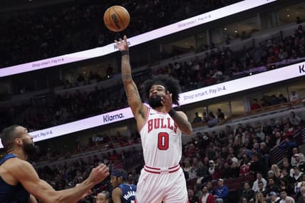 Feb 6, 2024; Chicago, Illinois, USA; Chicago Bulls guard Coby White (0) shoots over Minnesota Timberwolves center Rudy Gobert (27) during the first quarter at United Center. Mandatory Credit: David Banks-USA TODAY Sports
