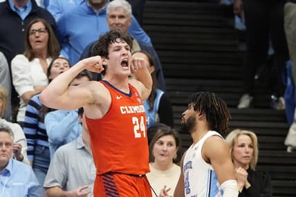 Feb 6, 2024; Chapel Hill, North Carolina, USA; Clemson Tigers center PJ Hall (24) and North Carolina Tar Heels guard RJ Davis (4) react in the second half at Dean E. Smith Center. Mandatory Credit: Bob Donnan-USA TODAY Sports