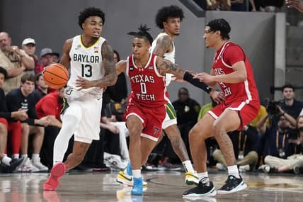 Feb 6, 2024; Waco, Texas, USA; Baylor Bears guard Langston Love (13) dribbles around Texas Tech Red Raiders guard Chance McMillian (0) during the first half at Paul and Alejandra Foster Pavilion. Mandatory Credit: Raymond Carlin III-USA TODAY Sports