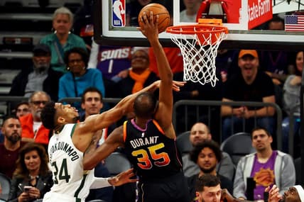 Feb 6, 2024; Phoenix, Arizona, USA; Phoenix Suns forward Kevin Durant (35) shoots the ball against Milwaukee Bucks forward Giannis Antetokounmpo (34) during the fourth quarter at Footprint Center. Mandatory Credit: Mark J. Rebilas-USA TODAY Sports