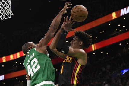 Feb 7, 2024; Boston, Massachusetts, USA;  Boston Celtics center Al Horford (42) blocks the shot of Atlanta Hawks forward Jalen Johnson (1) during the first half at TD Garden. Mandatory Credit: Bob DeChiara-USA TODAY Sports